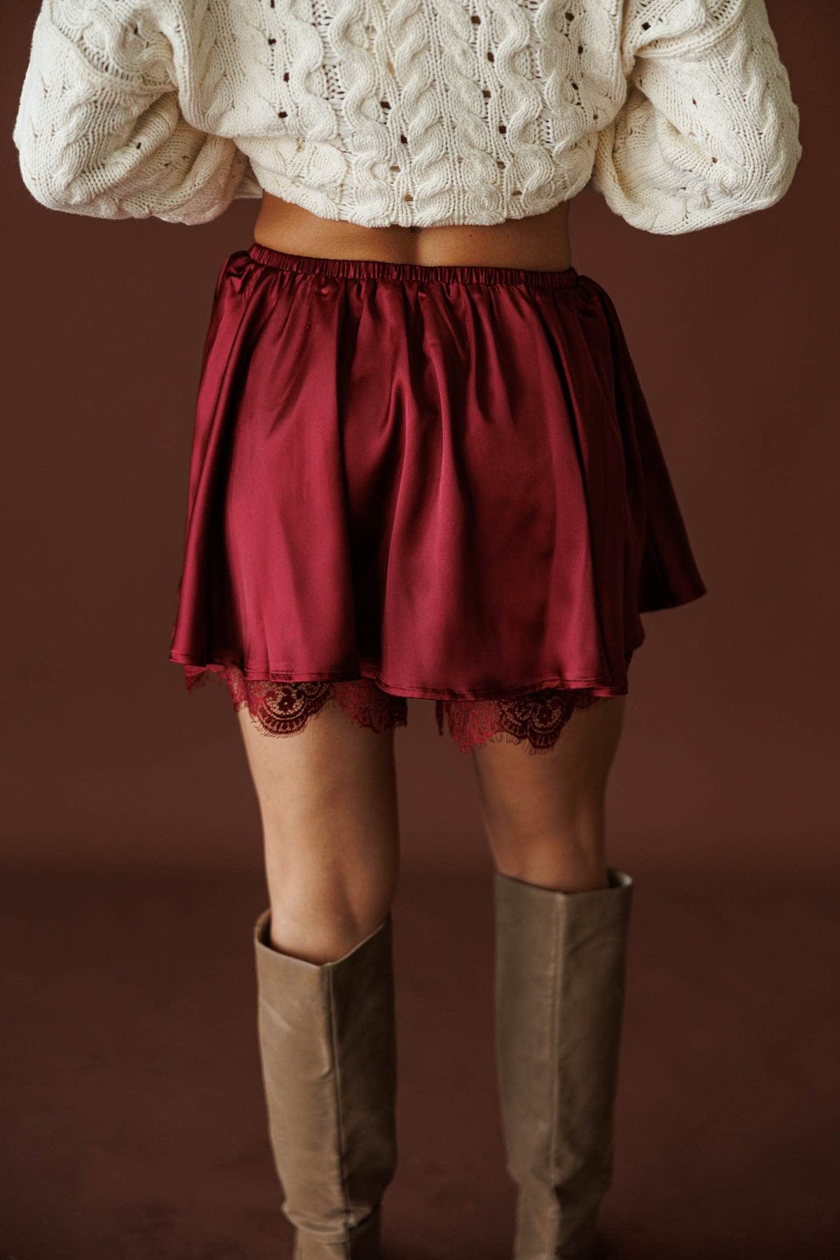 Satin And Lace Skort in burgundy, front view of the flared satin skort