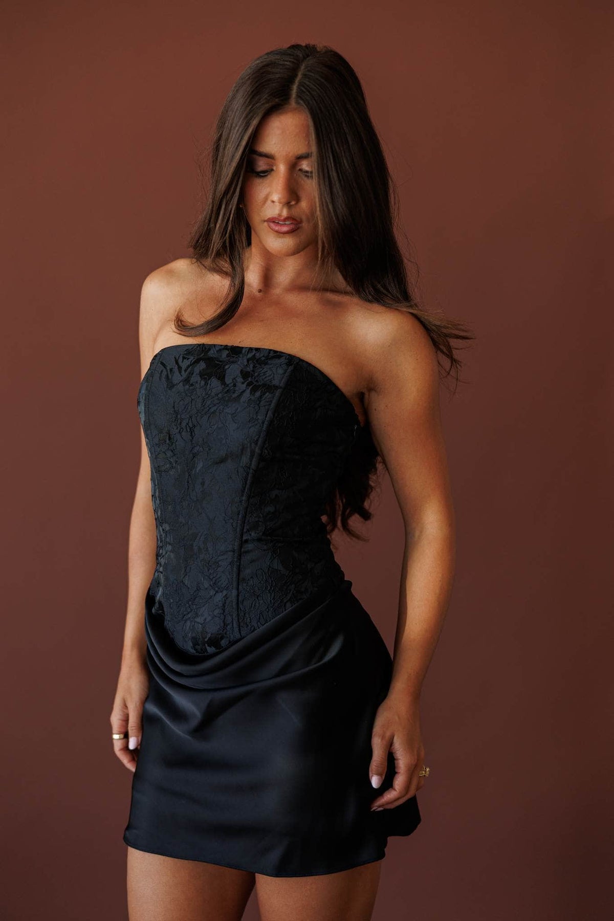 After Hours Corset Mini Dress, in black, close view of the bodice and draped waist