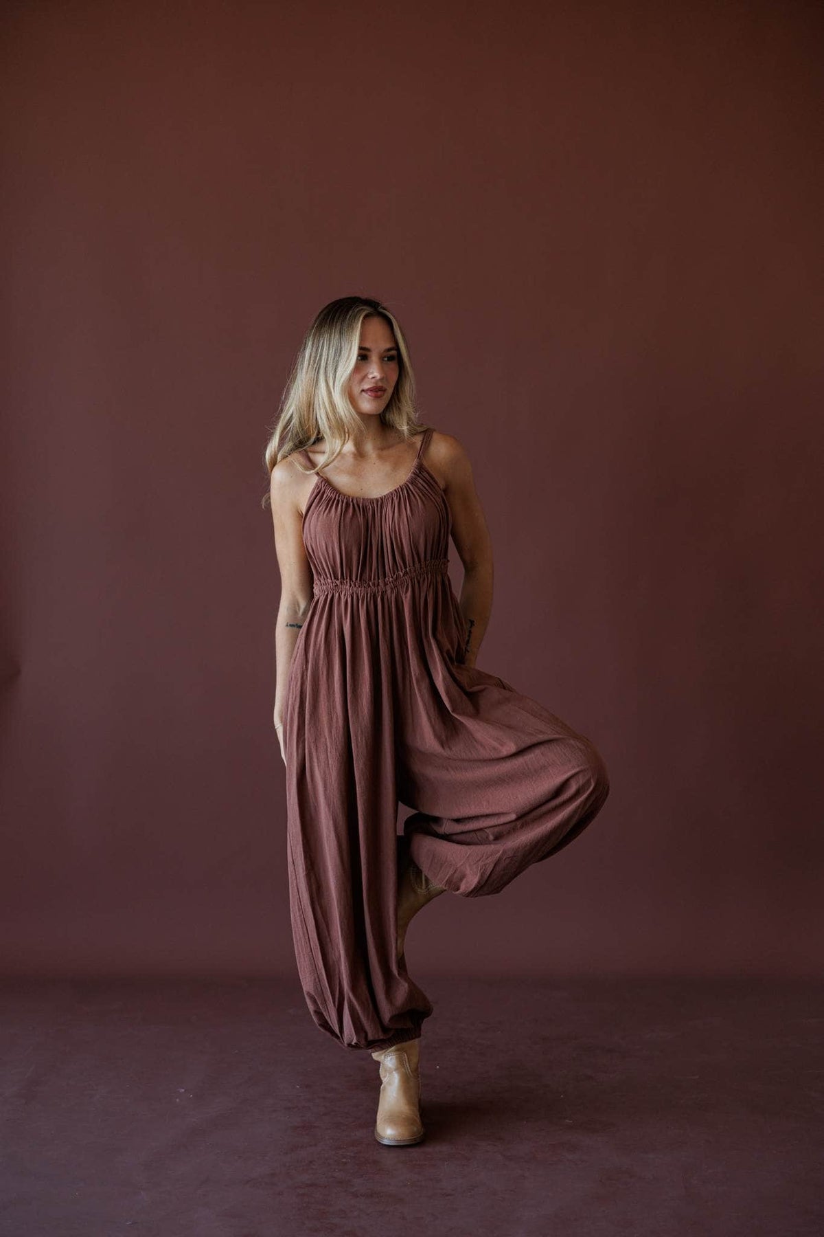The Roam Jumpsuit, in brown, full-length front view of the balloon jumpsuit