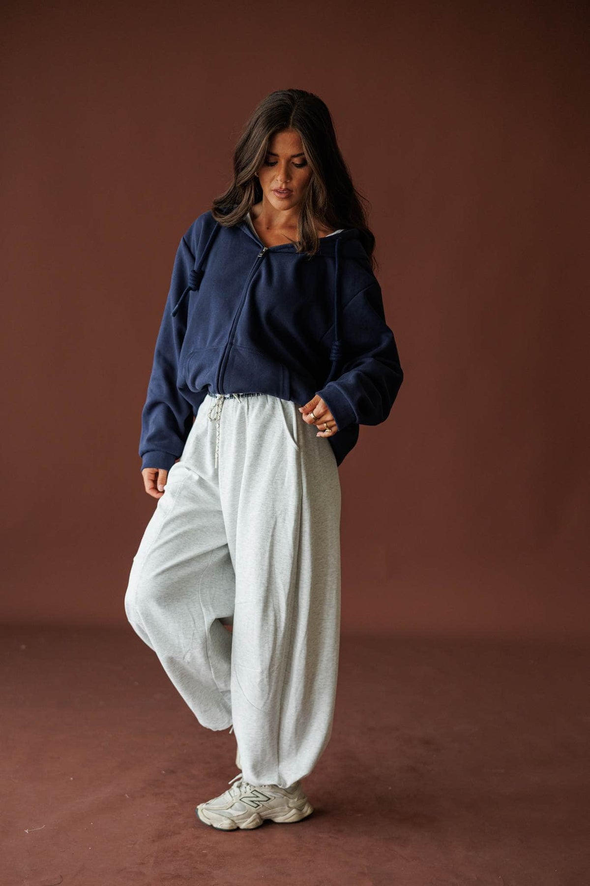 Slow Down Wide Leg Joggers in light heather grey, full-length walking view with a navy jacket