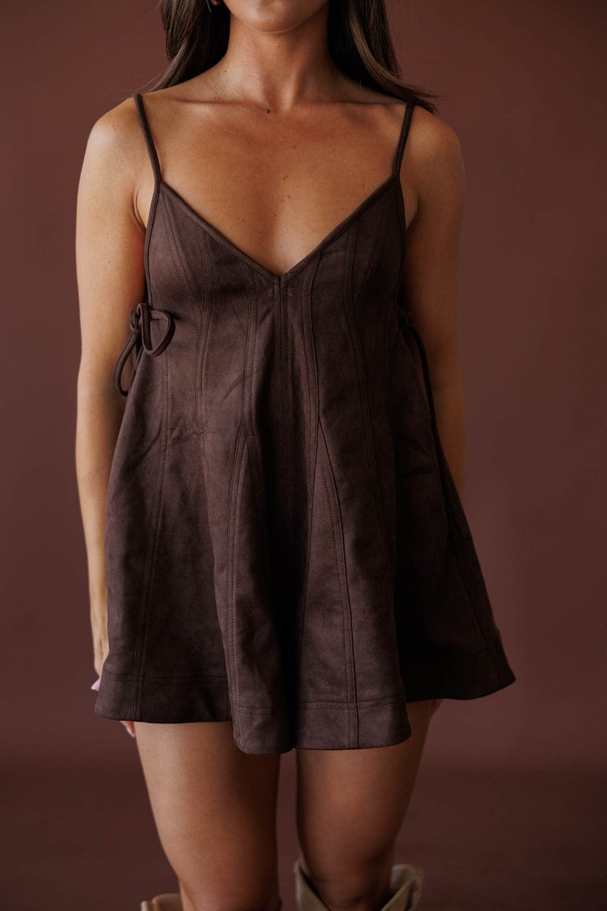 Dark Brown Suede Romper, close front view of the v-neckline