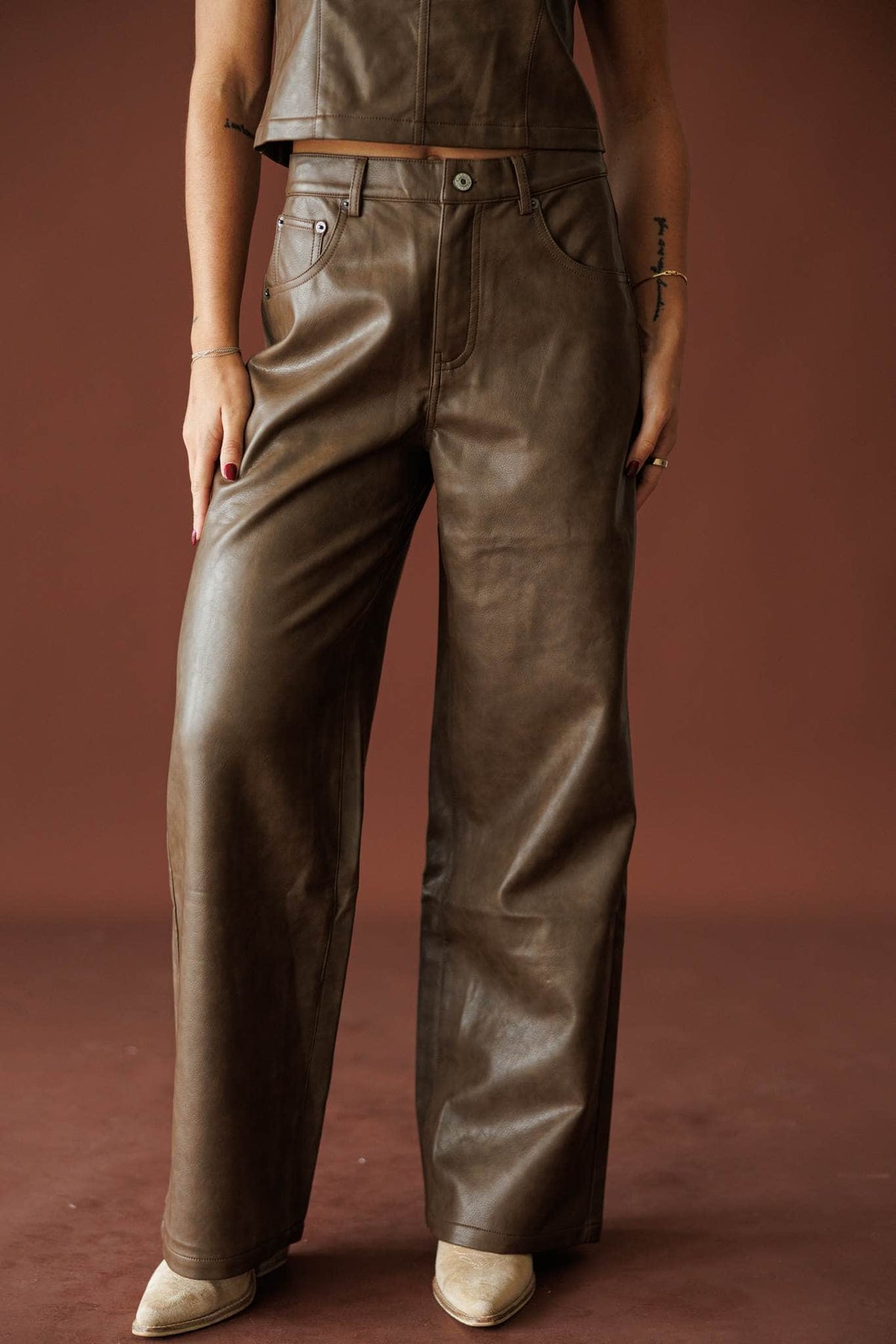 Trouble Tonight Leather Pants in brown, front view of the wide leg with booties