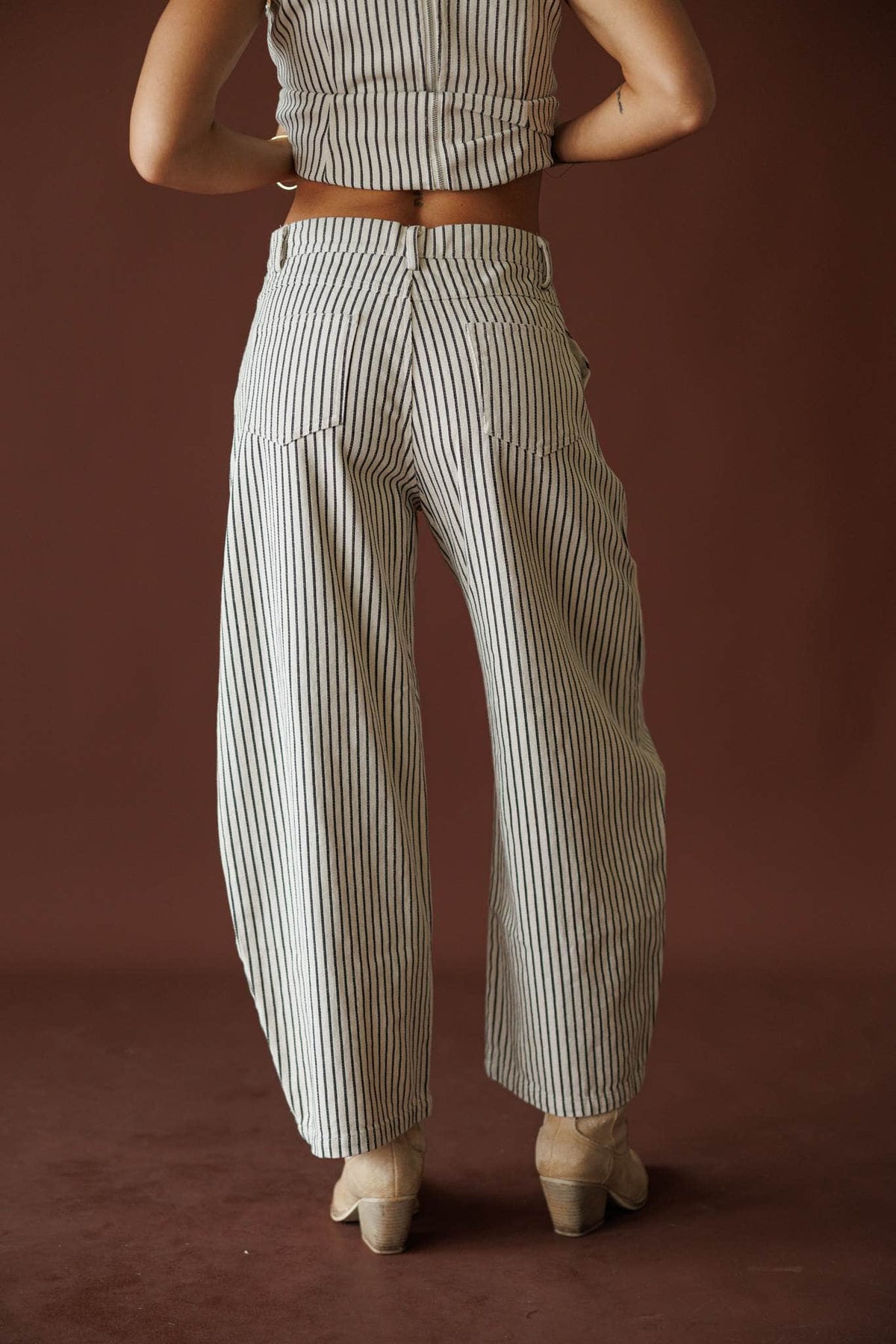 Day In The City Barrel Pants in natural pinstripe, front view of the tapered barrel hem