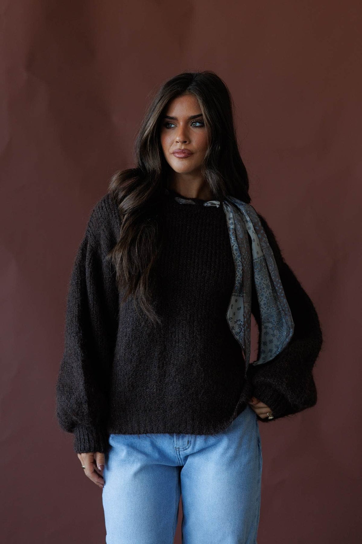 Brown sweater with satin scarf neck tie, front view