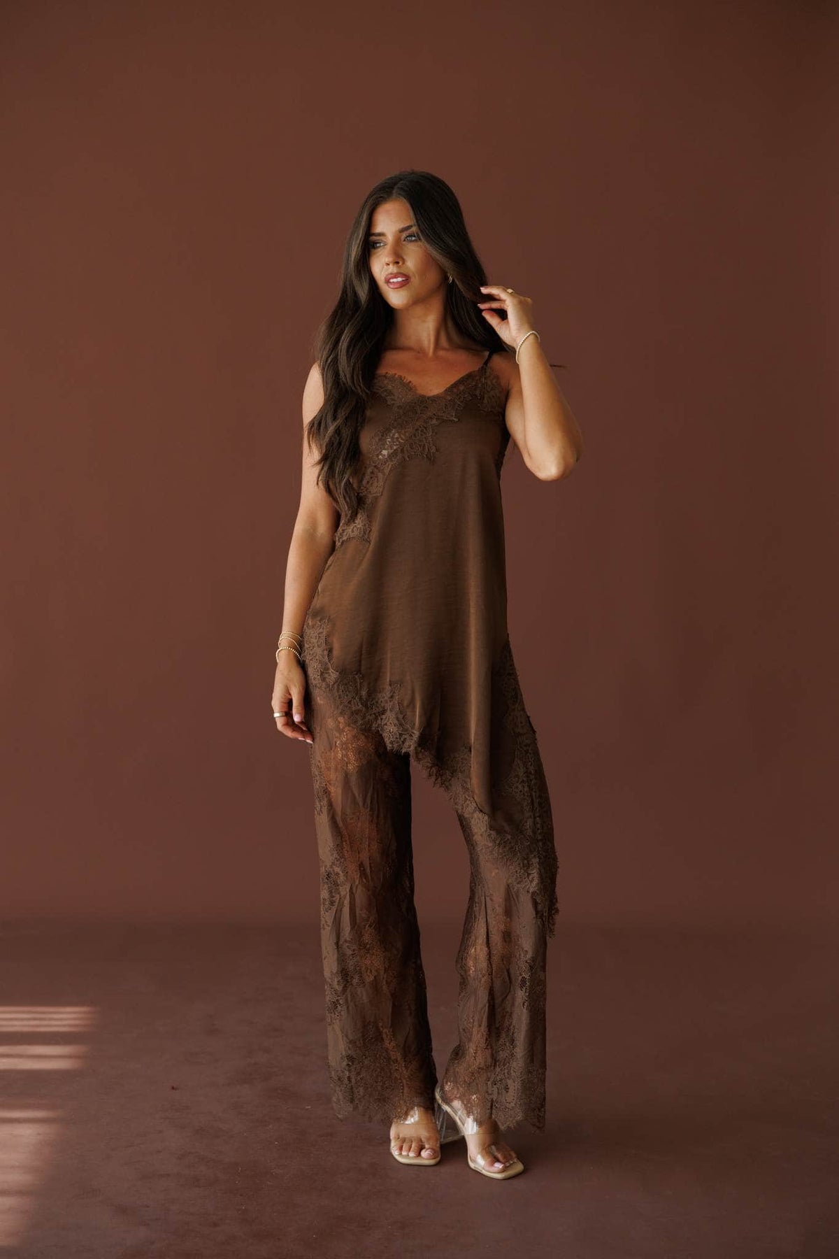 Love Letters Lace Top in brown, front view on model with one hand raised