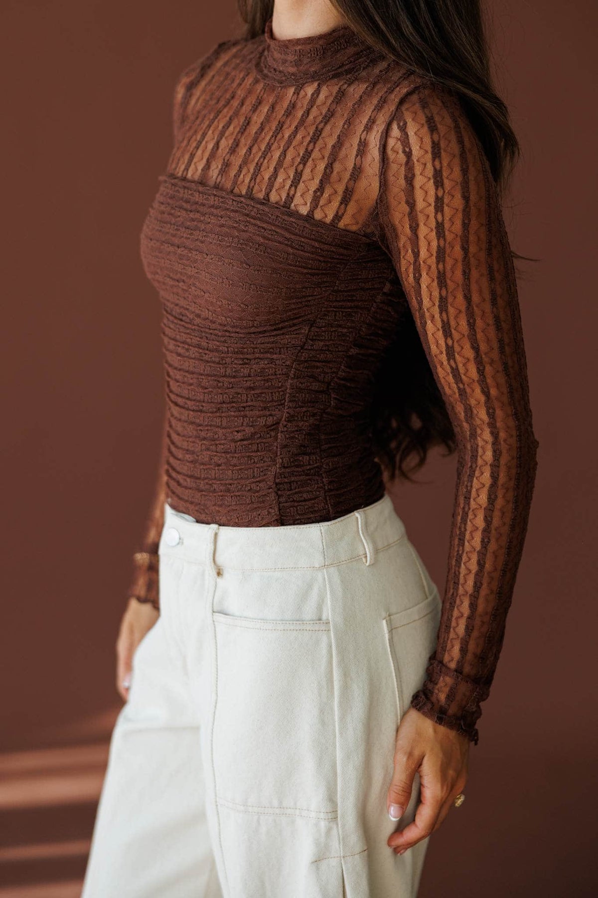 Lover In Lace Bodysuit in brown, side view showing the sheer lace sleeve