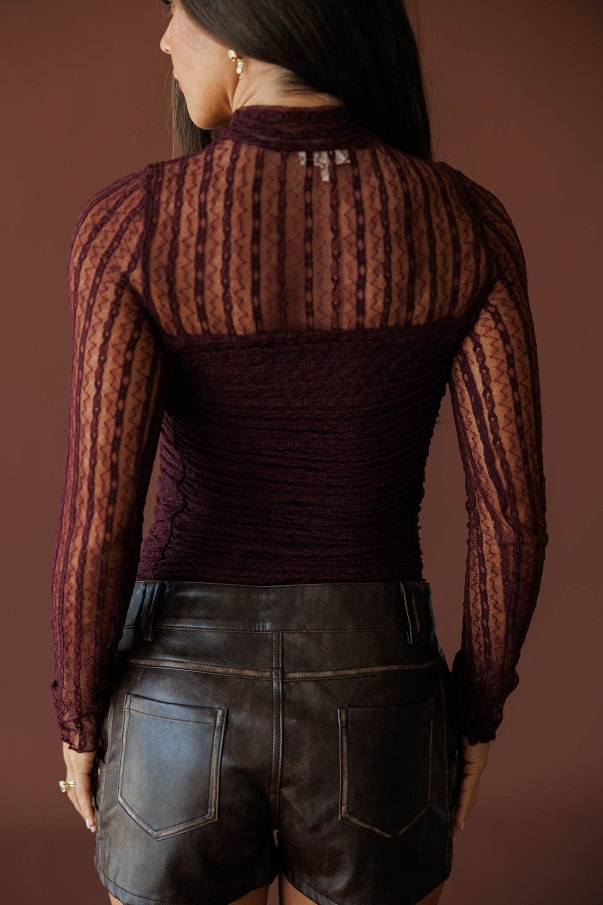 Lover In Lace Bodysuit in baked plum, back view showing the sheer lace back