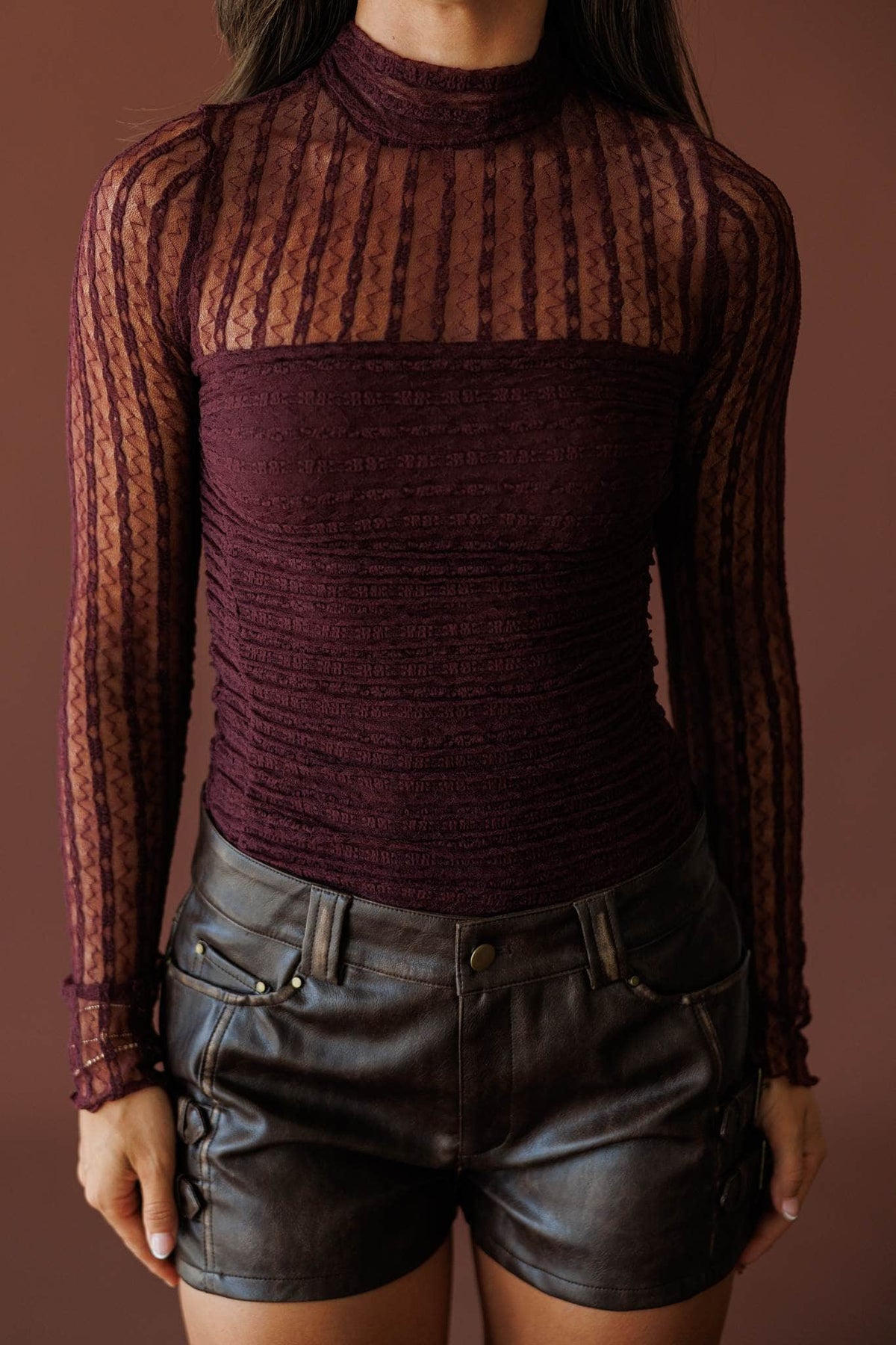 Lover In Lace Bodysuit in baked plum, front close-up of the sheer lace and mock neck