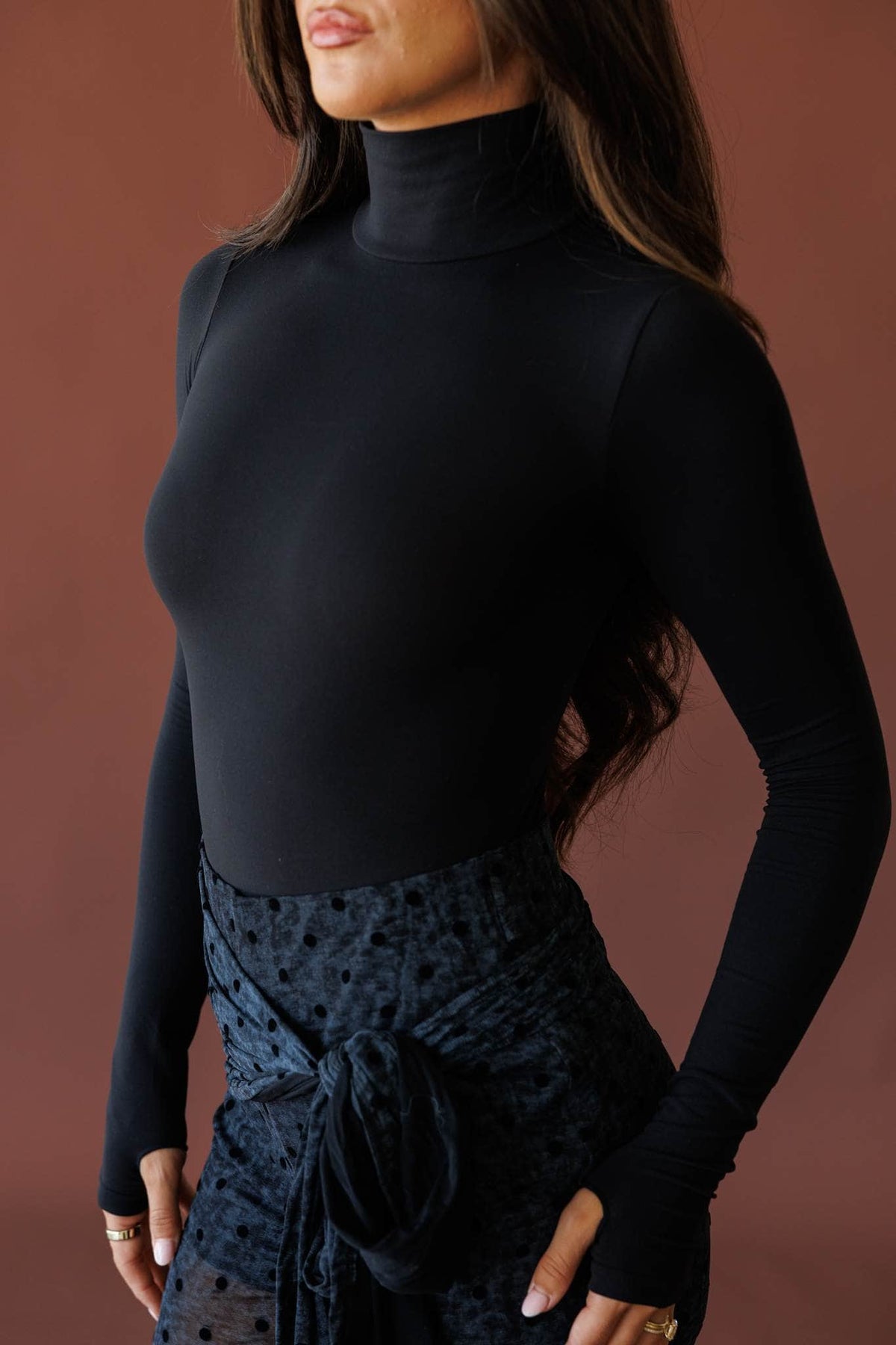 Black turtleneck bodysuit
