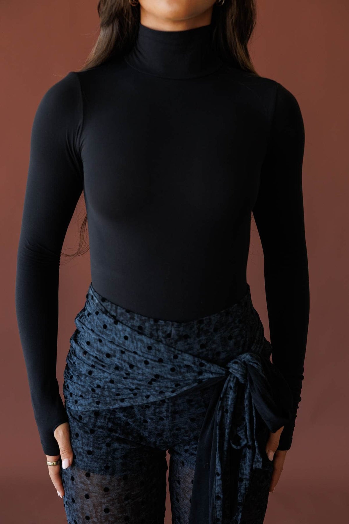 Black turtleneck bodysuit