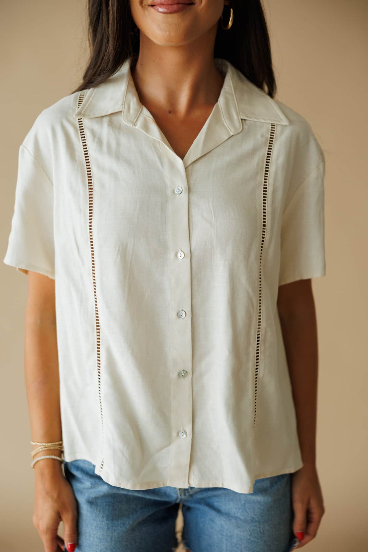 The Coastline Shirt in cream, front close-up of the camp collar and ladder stitch trim