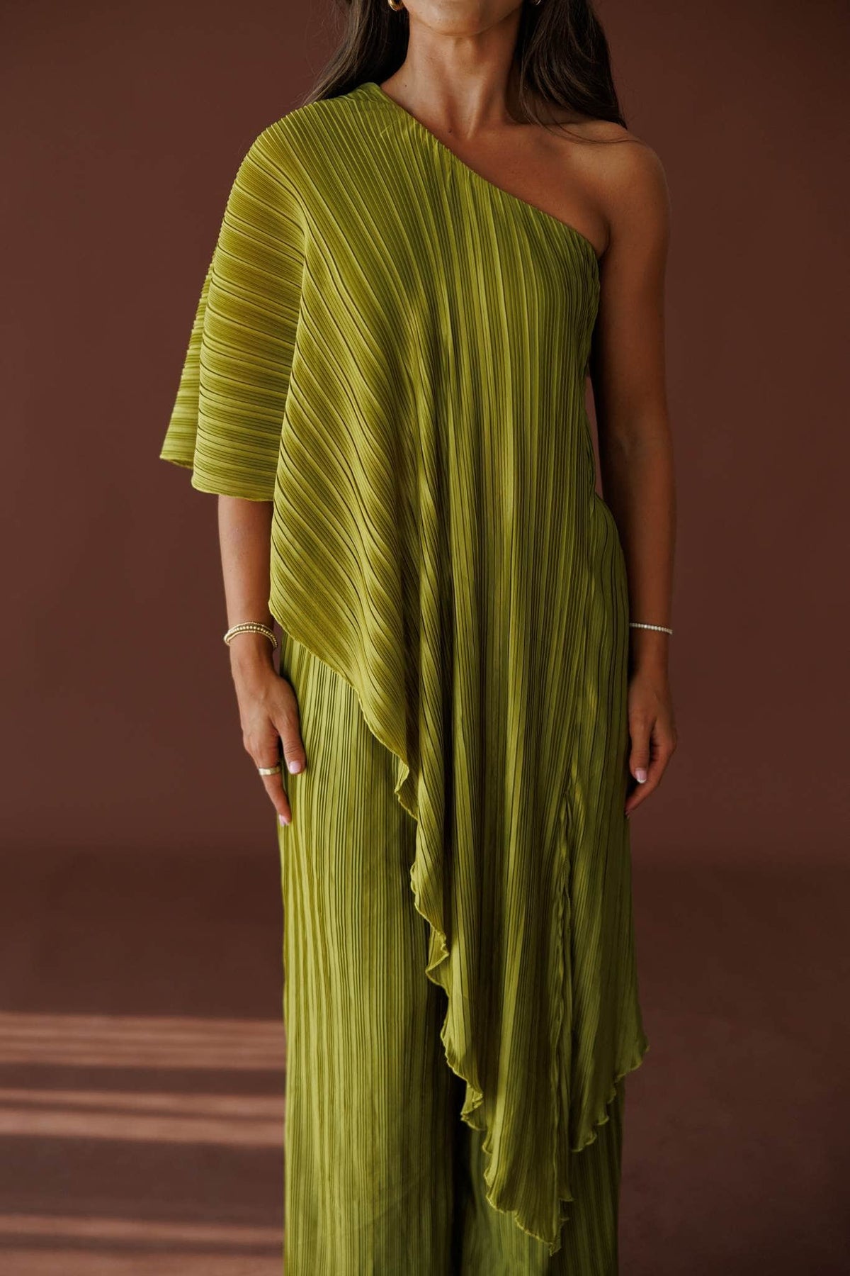 Muse Moments Pleated Top in olive, front close-up of the draped pleated cape