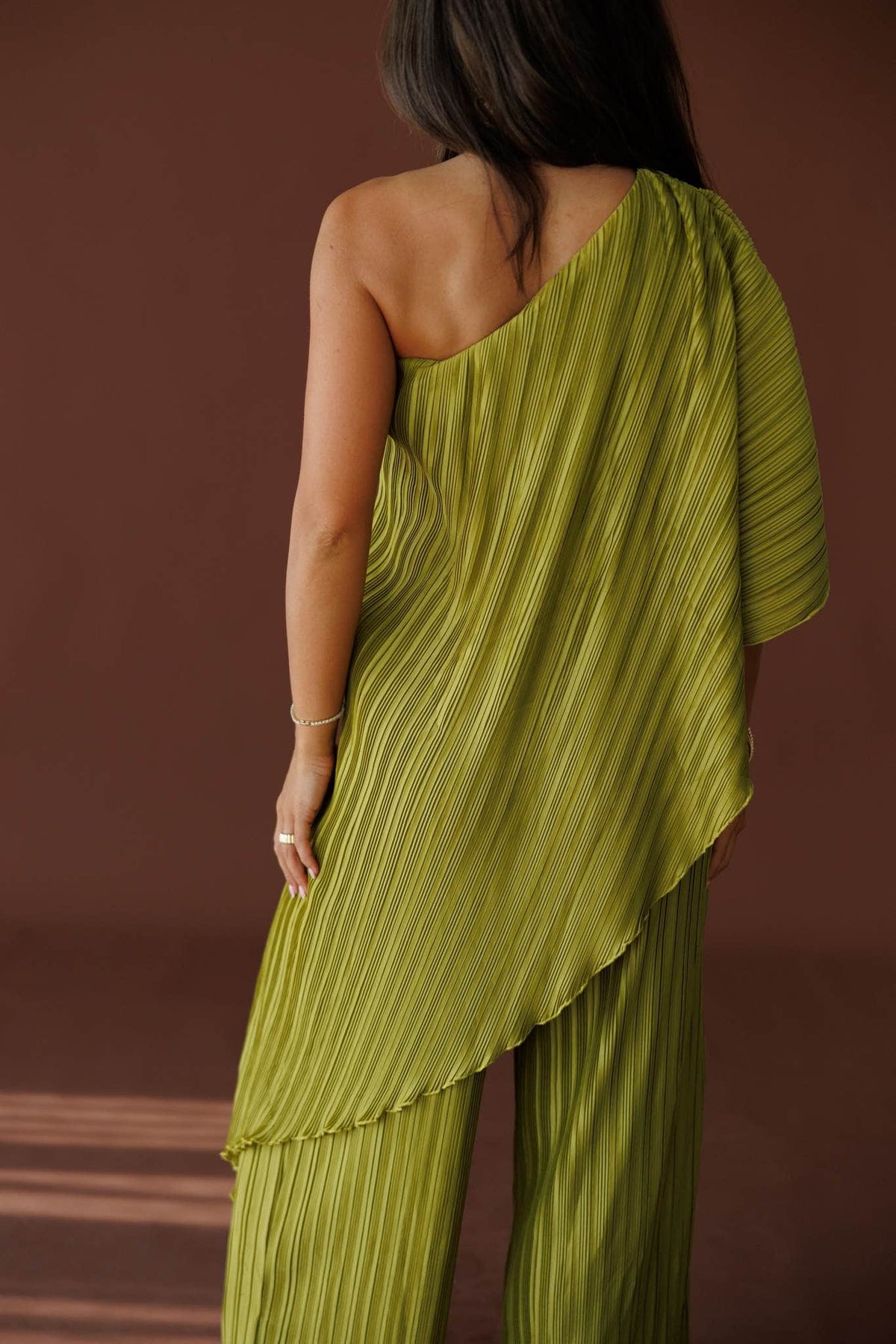 Muse Moments Pleated Top in olive, back view showing the pleated cape