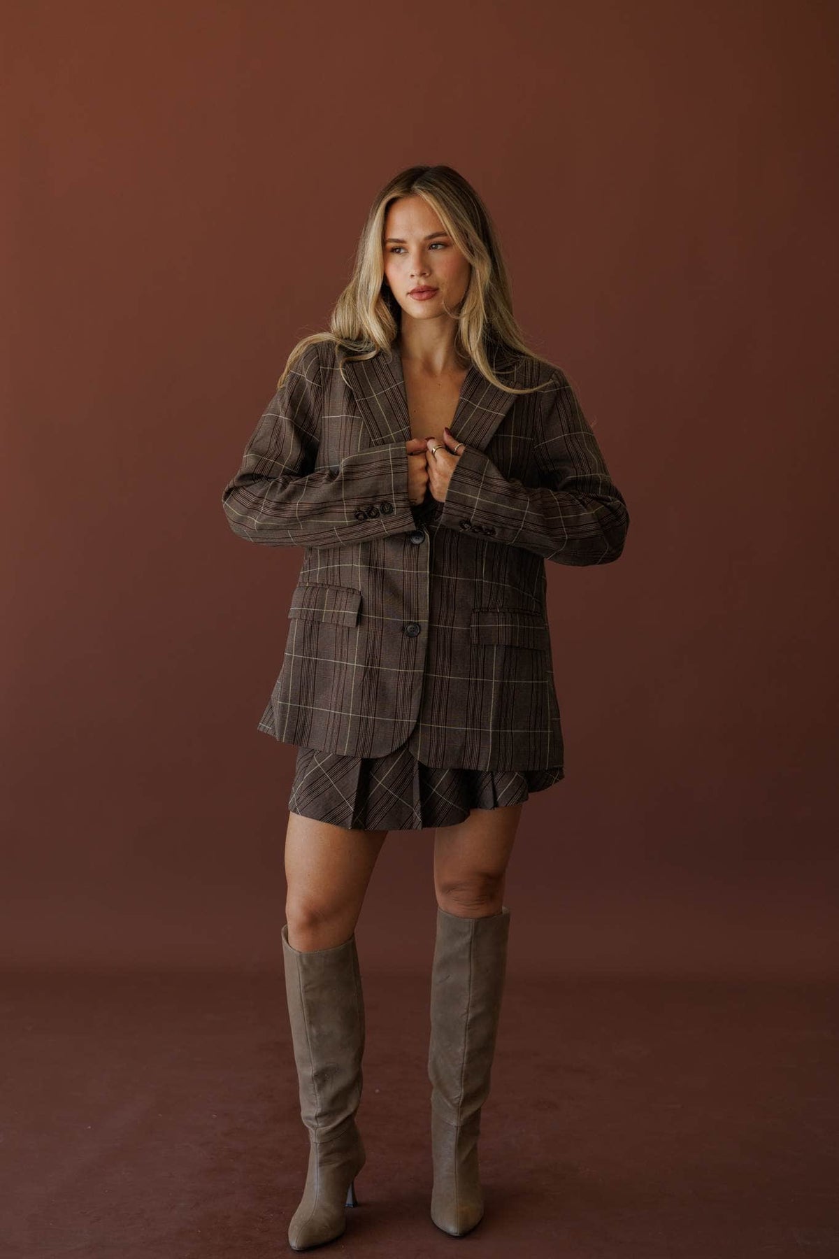 Board Meeting Plaid Blazer, full-length view with the matching plaid skort and tall boots