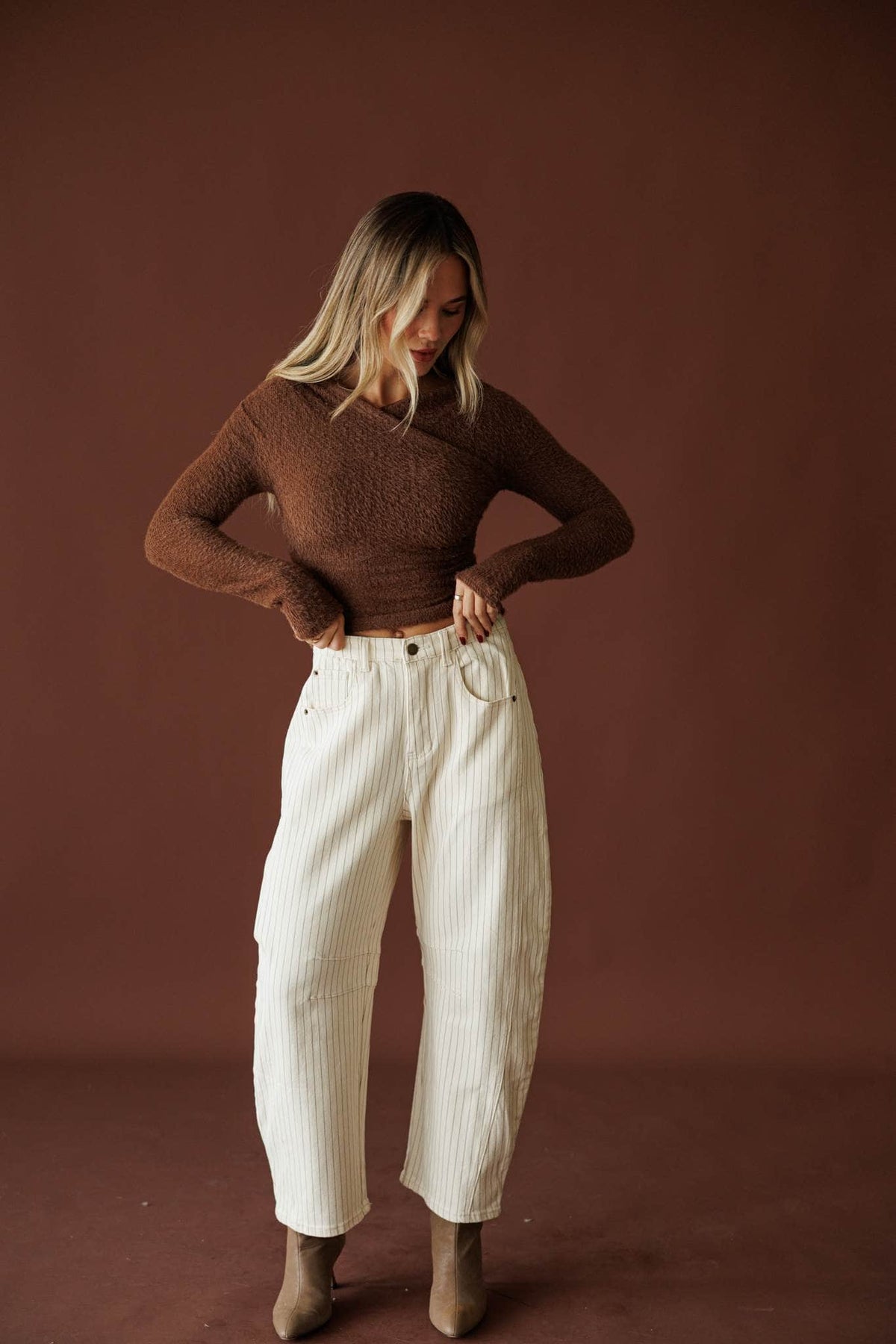Astor Pinstripe Pants, in cream, full-length front view with a brown knit top