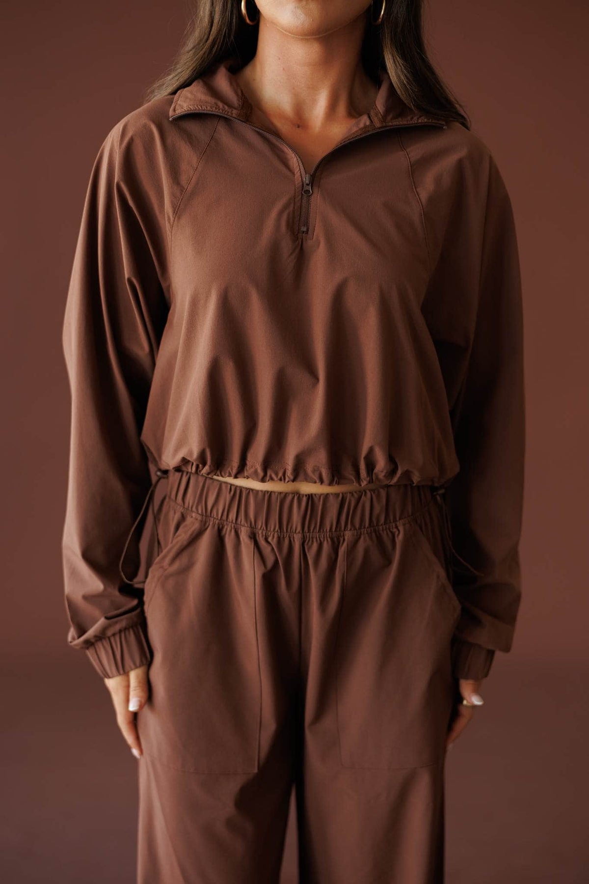 Pace Yourself Half Zip Pullover in cocoa, front close-up of the half zip and collar