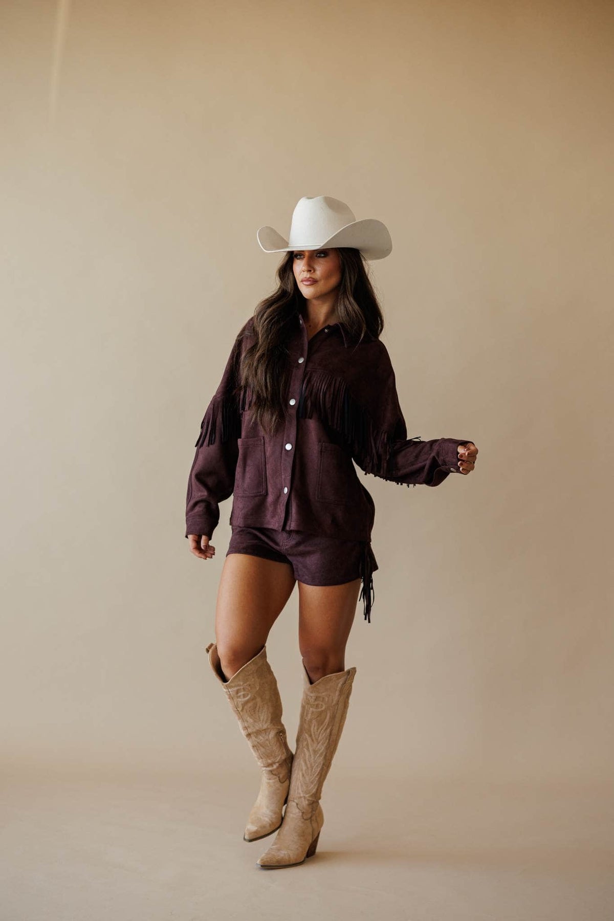 Dark brown suede shorts with fringe
