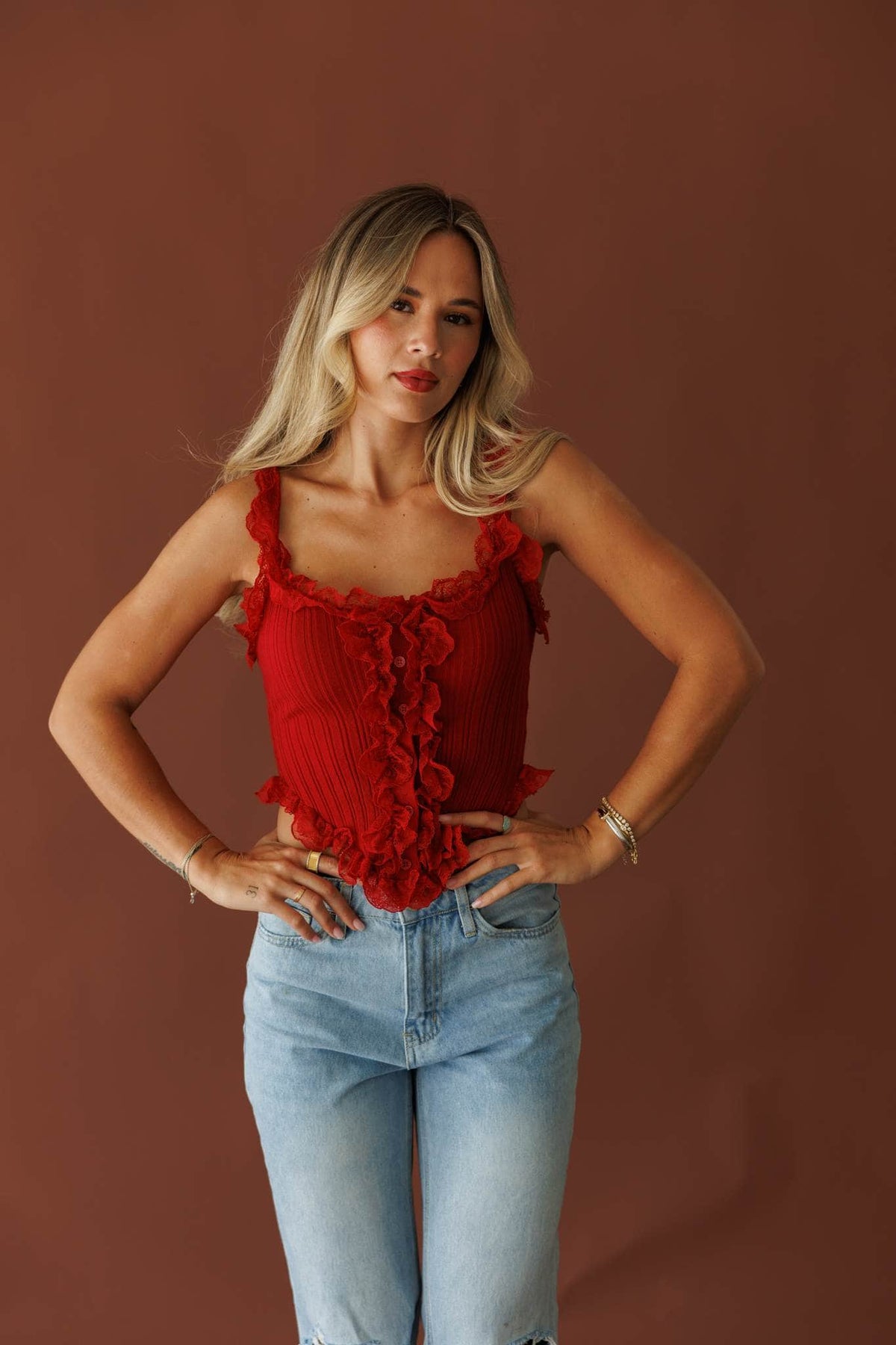 Pretty Little Secret Top in pomegranate, full-length view on model with hands on hips