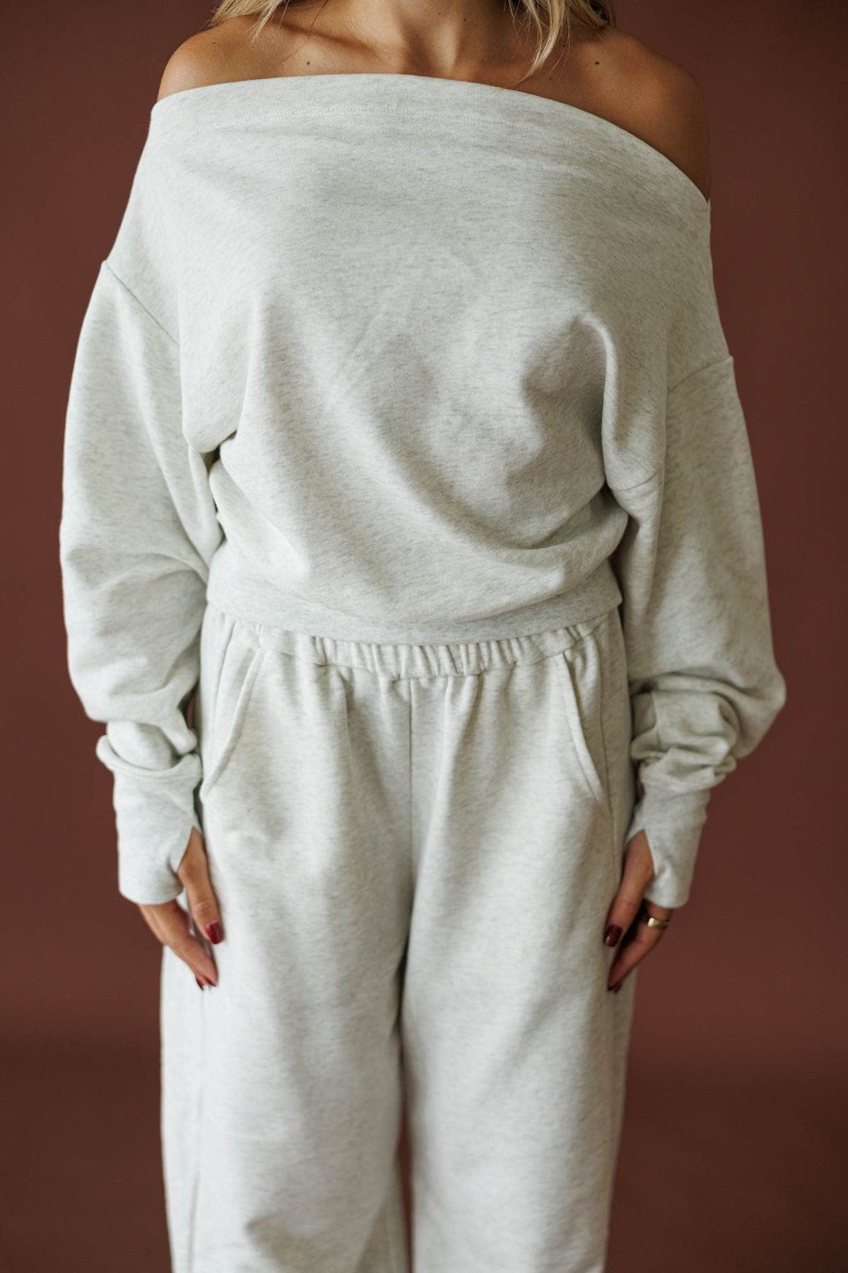 Slow Sunday Terry Top in heather grey, side view showing the banded hem and long sleeve