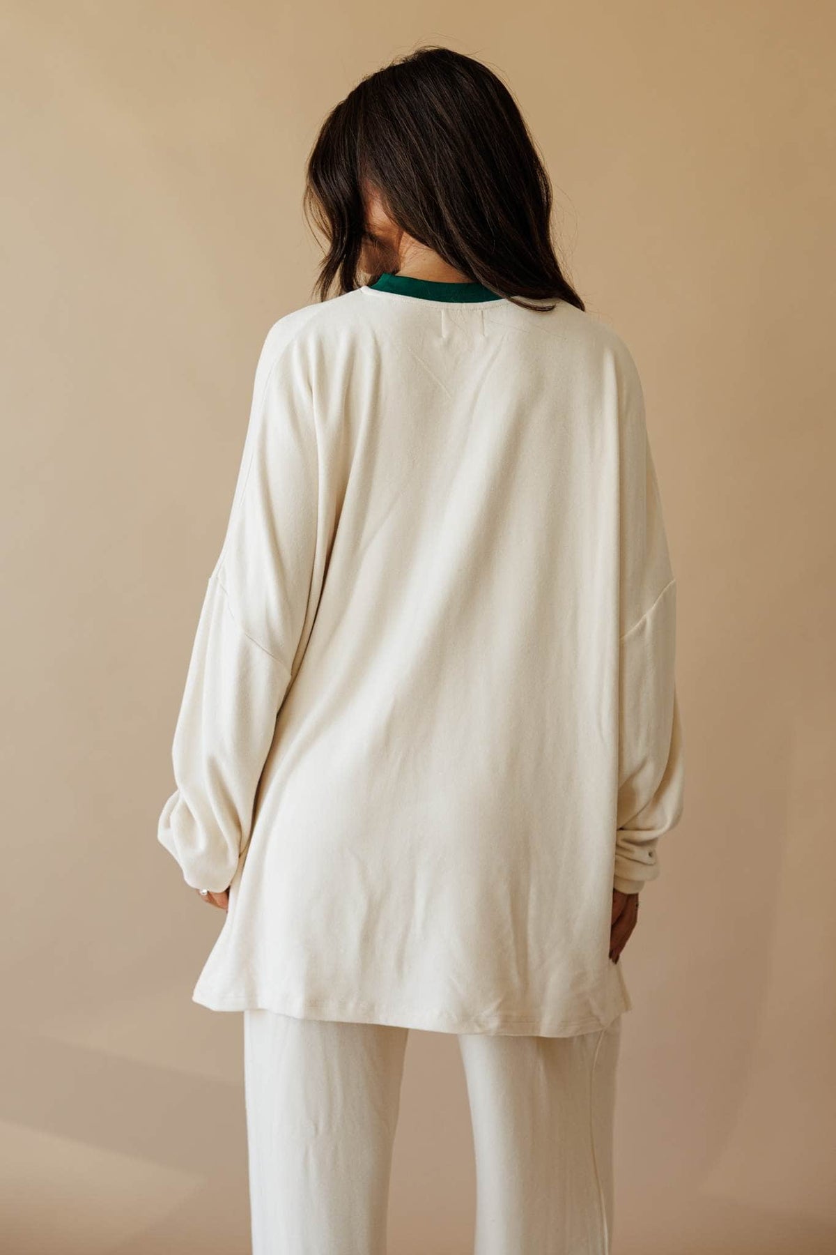 Cream oversized knit top with side slit