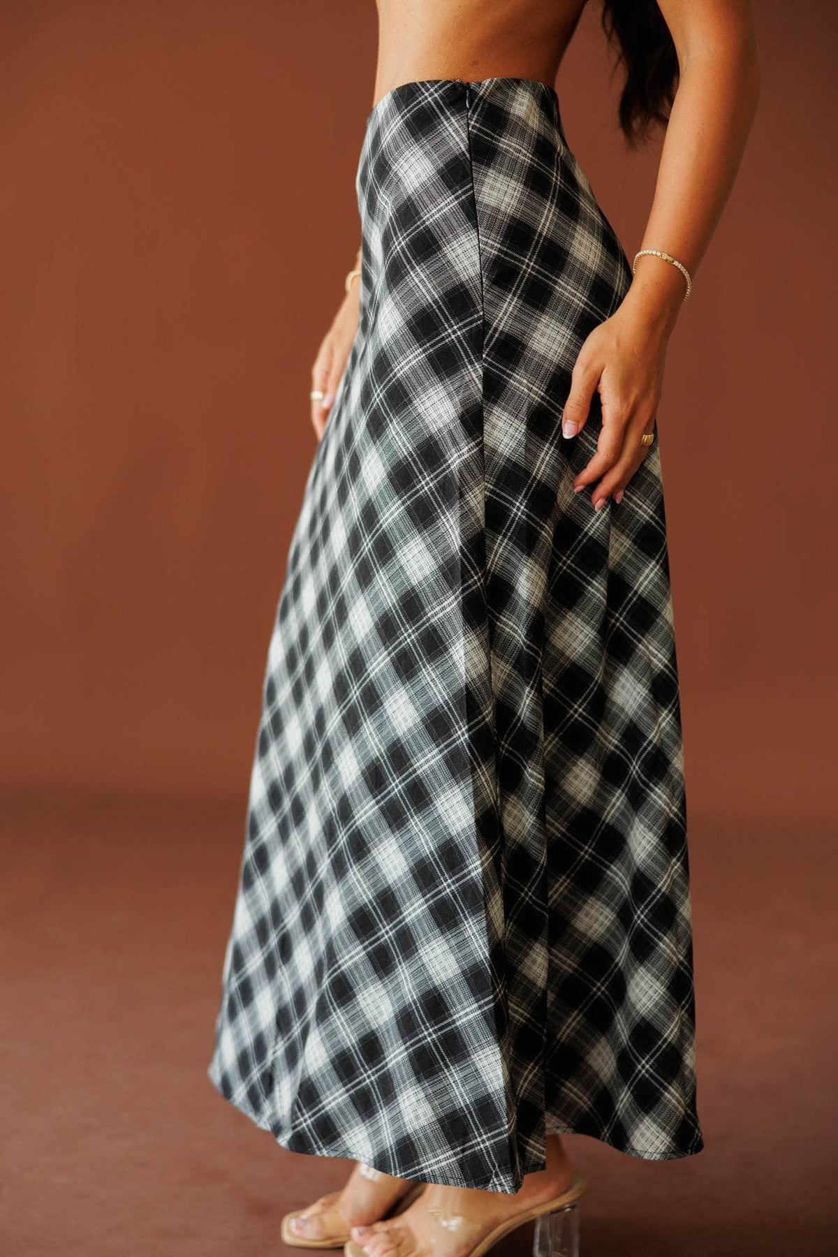 Town Square Plaid Skirt in black, side view showing the bias cut plaid
