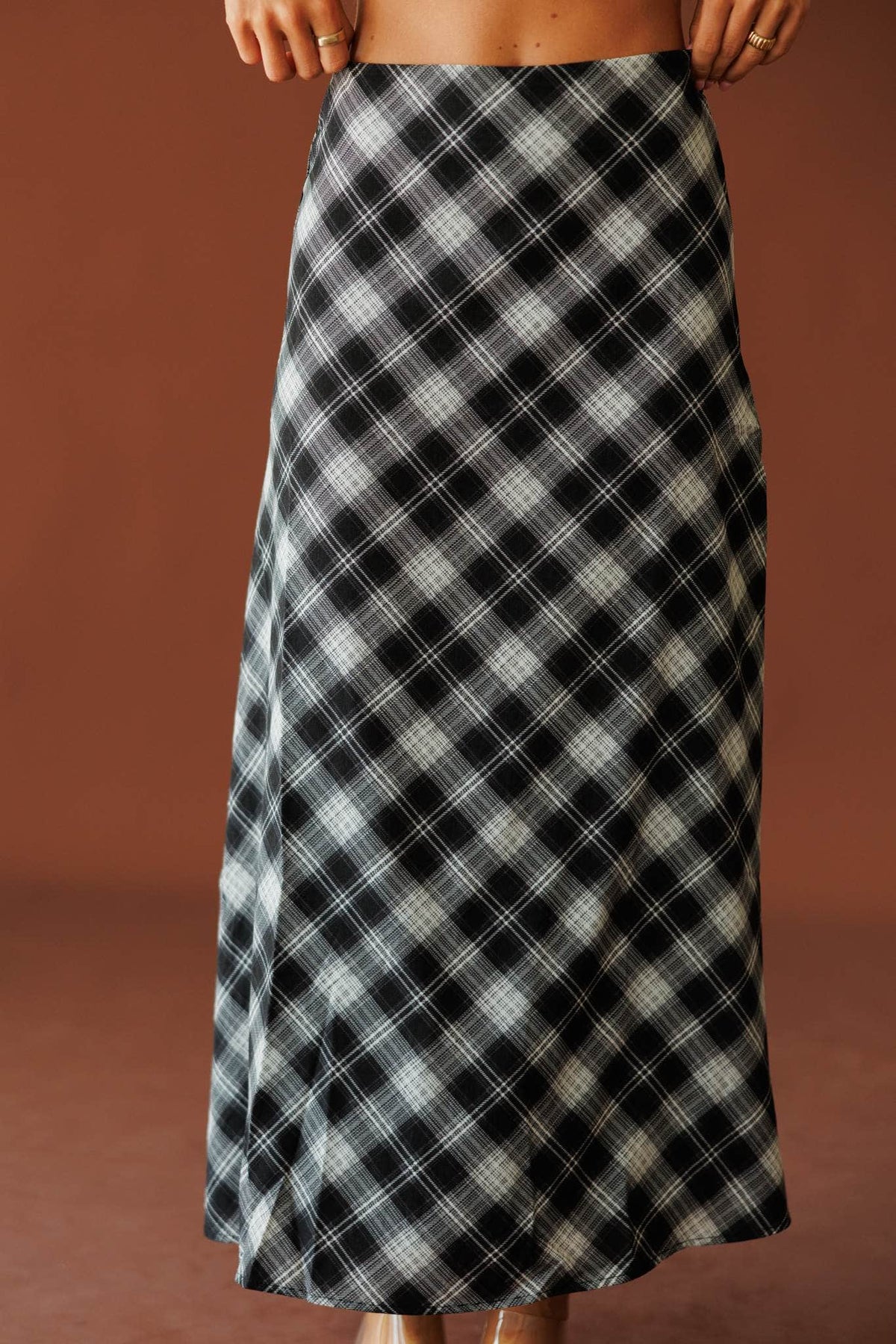 Town Square Plaid Skirt in black, front close-up of the plaid print and smooth waist