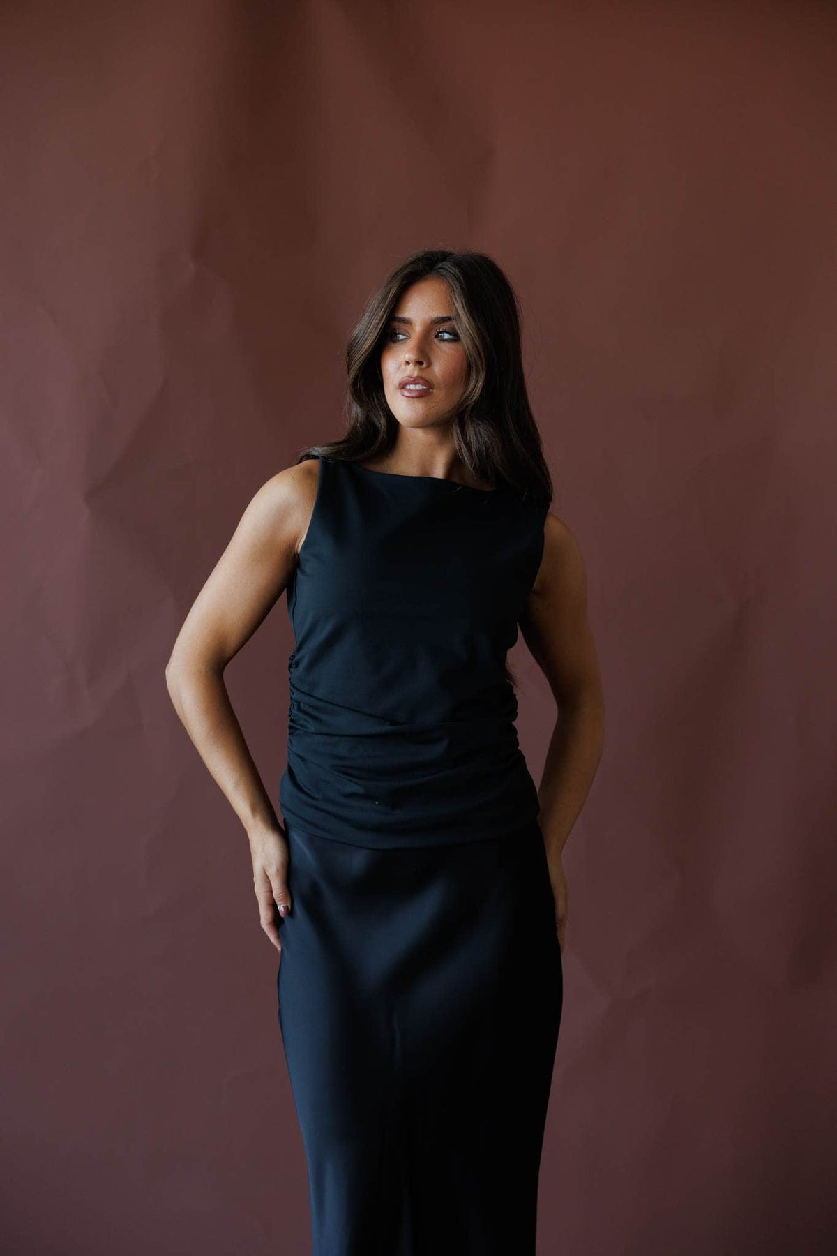 Black sleeveless ruched top, front view