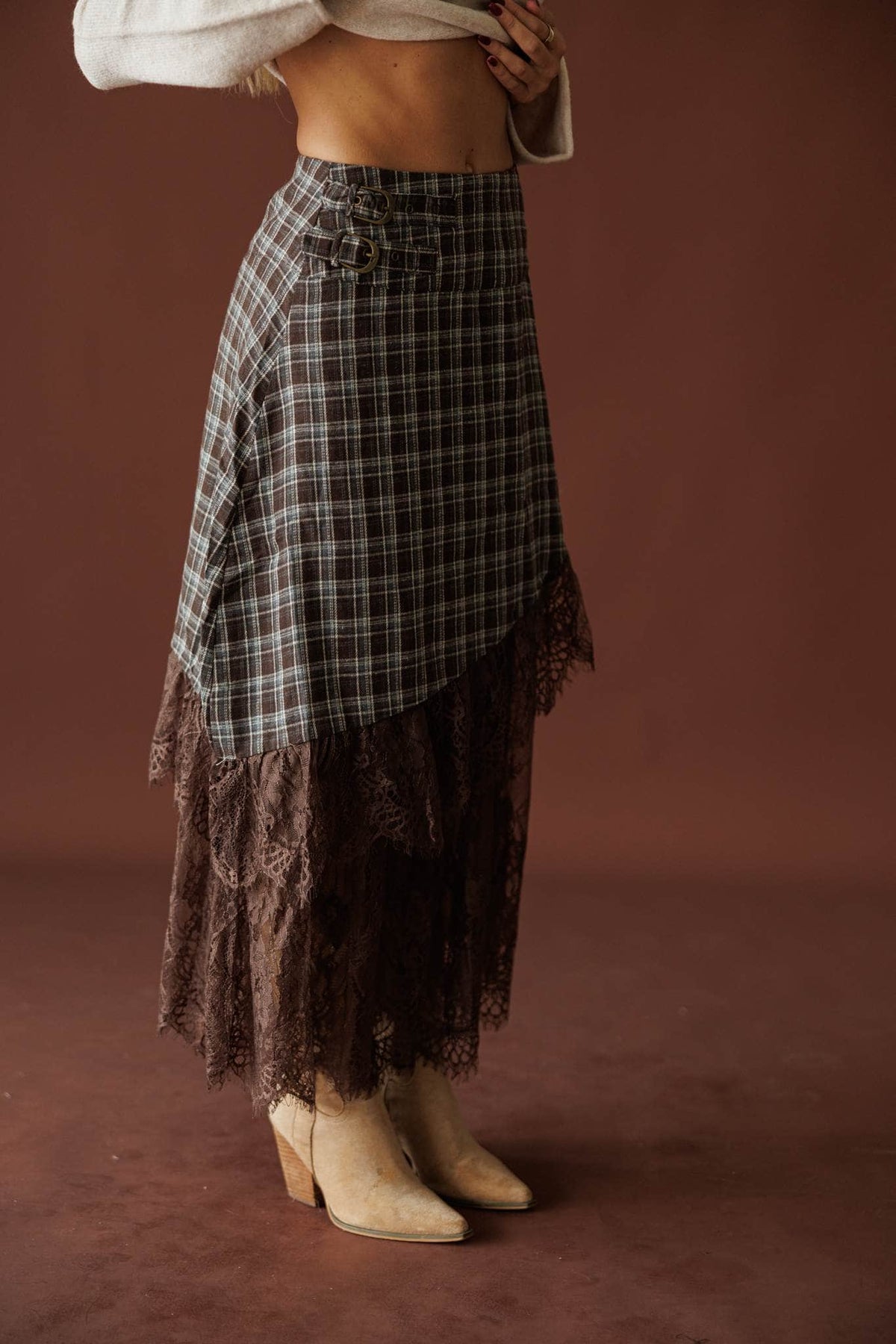 Lost In Wyoming Plaid Skirt in brown, back view of the midi length with booties